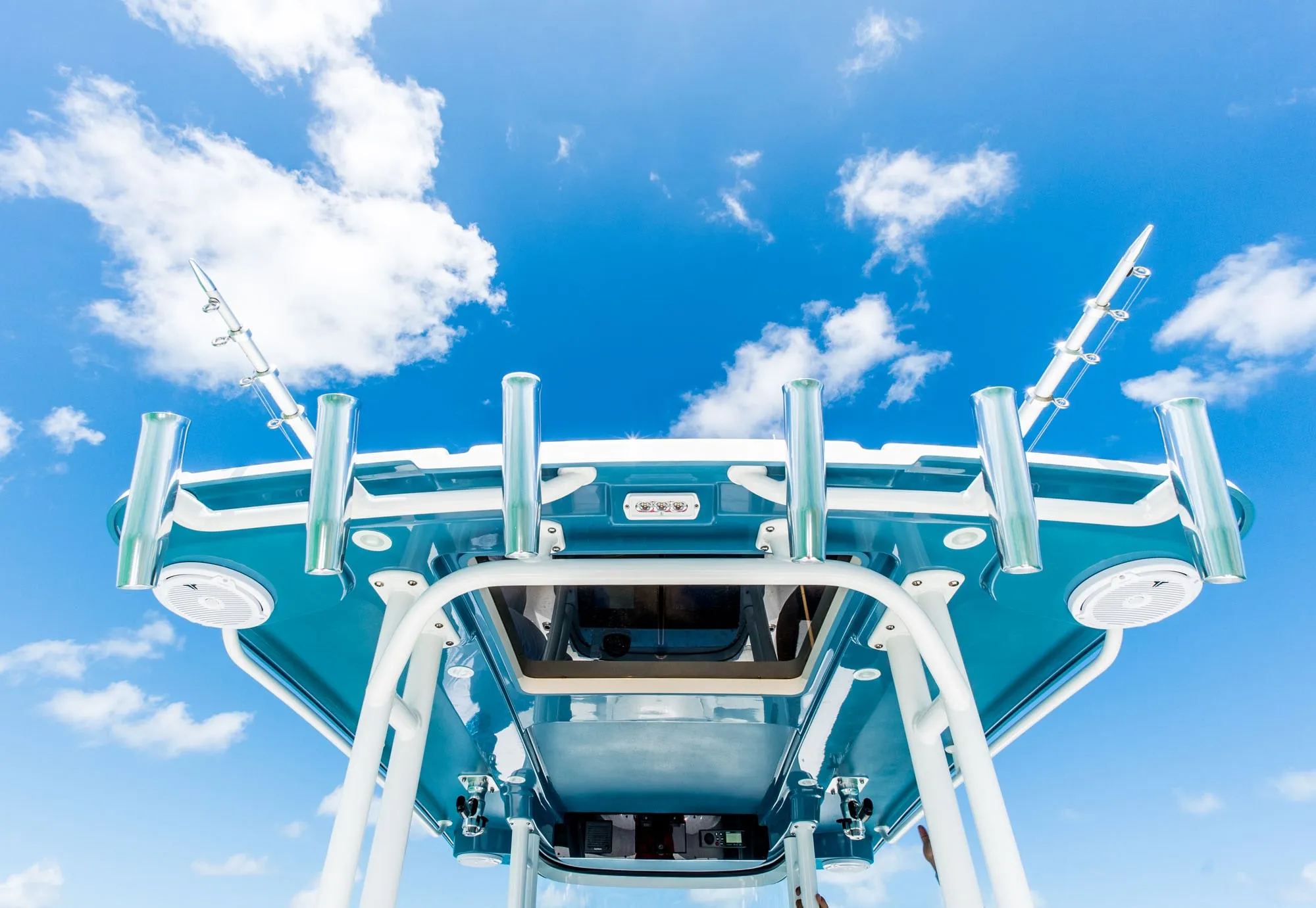 Family fishing and enjoying the sun on an EdgeWater 325CC in Australia/NZ.